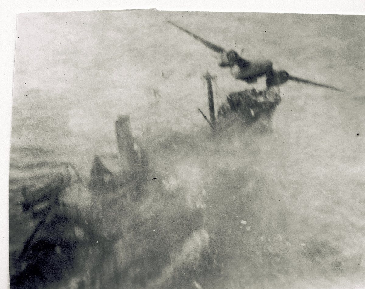 Allen's own photograph, taken from his aircraft during a low-level attack run — blurred by the plane's speed and vibration, but one of the few images in his collection shot in the middle of an actual mission.