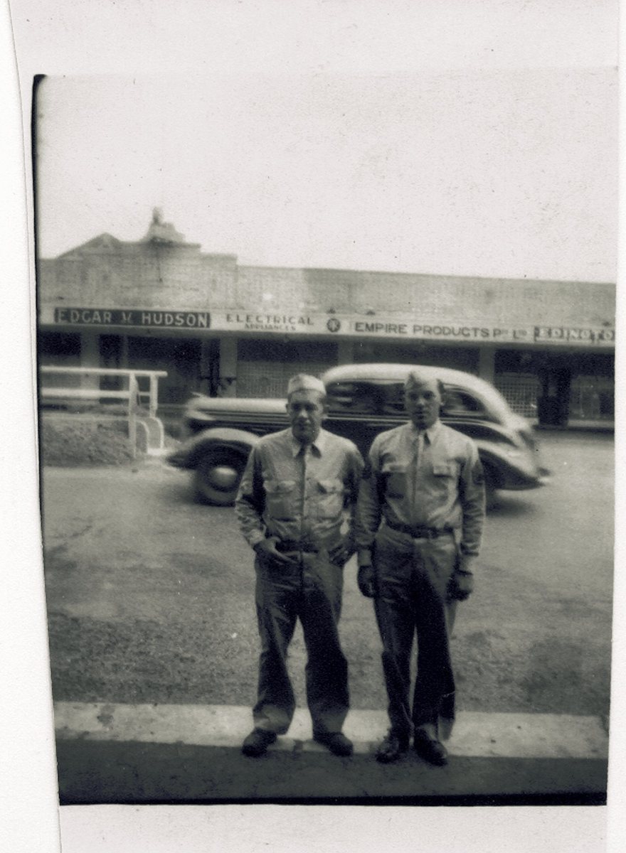 Allen (with his cousin) on an Australian street, outside the Edgar V. Hudson electrical shop — the reunion he describes below, half a world from home.