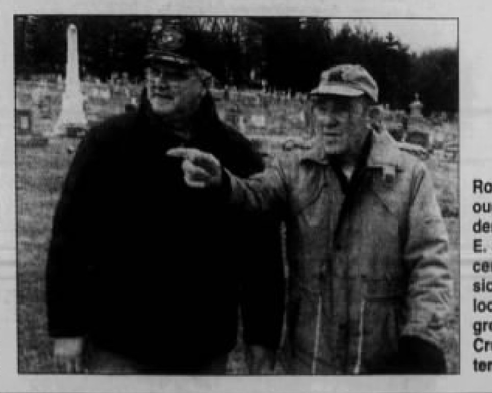 Cressona Cemetery, October 2005. Allen at the right, reaching across to point something out, with Robert A. Barr, the borough council president, beside him. The paper's own caption reads: 