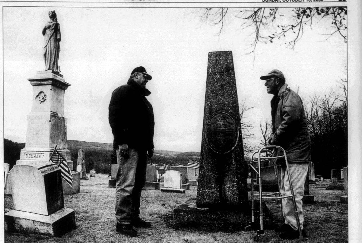 Cressona Cemetery, October 2005. Allen, right, at eighty-seven and on a walker, with Robert A. Barr, borough council president, at one of the earliest graves in the ground &mdash; that of Theodore Alexis Classen, a native of Finland, from 1855. Allen had come off the cemetery commission the year before, after twenty years on it. Photograph by Jacqueline Dormer, Republican & Herald.