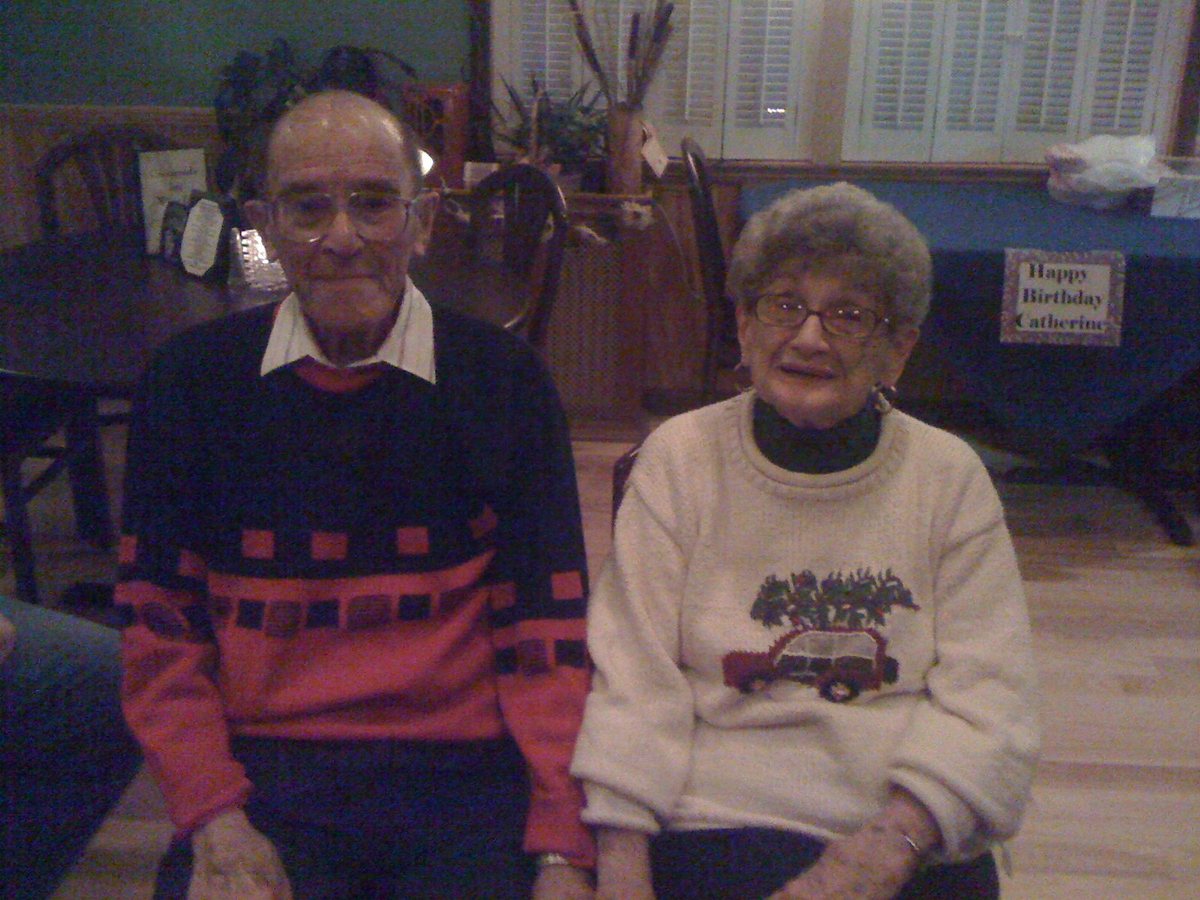 Allen and Catherine, decades later, at one of Catherine's birthdays — still together.