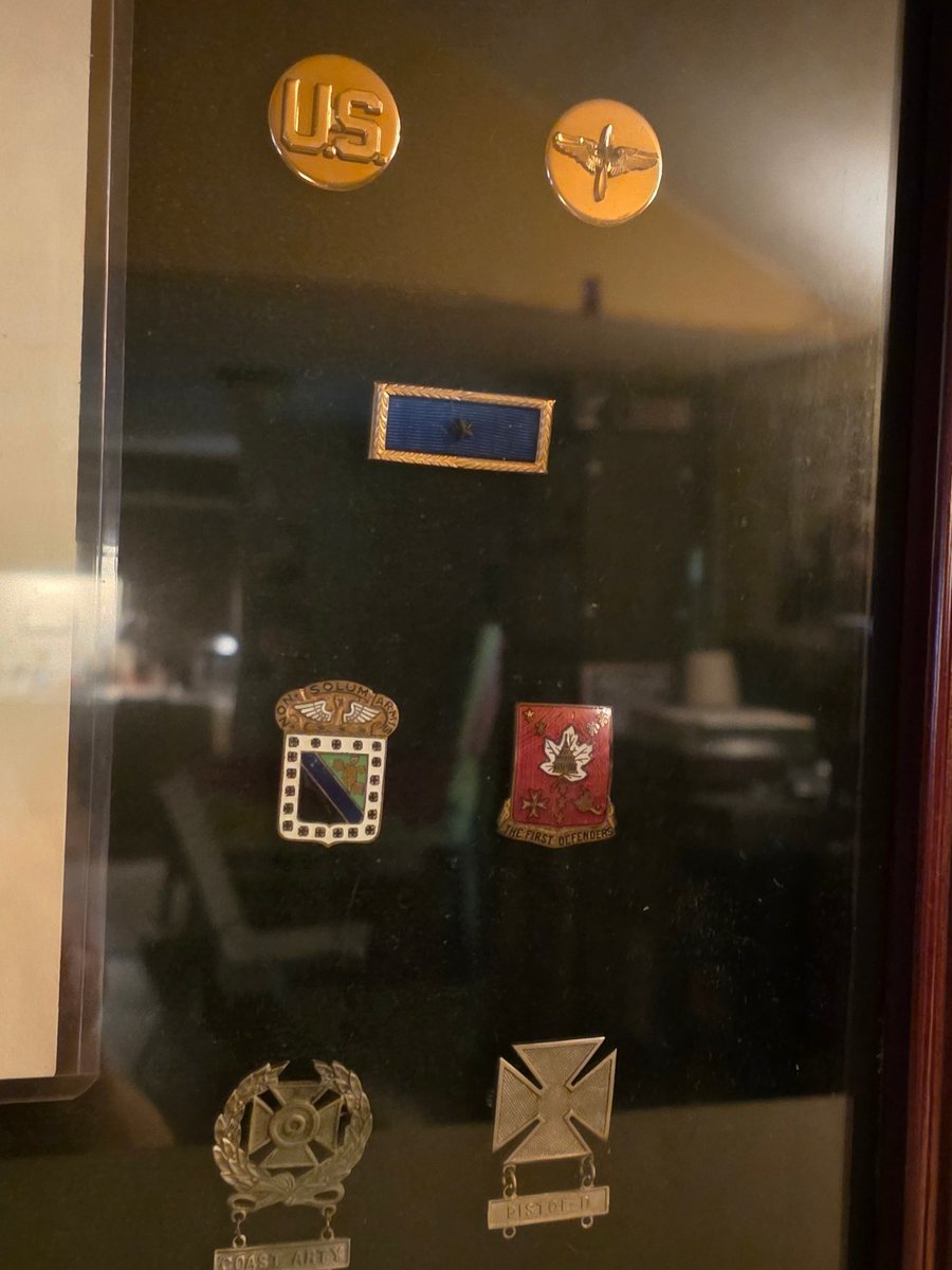 Collar and unit insignia, and marksmanship qualification badges, from Allen's own collection.