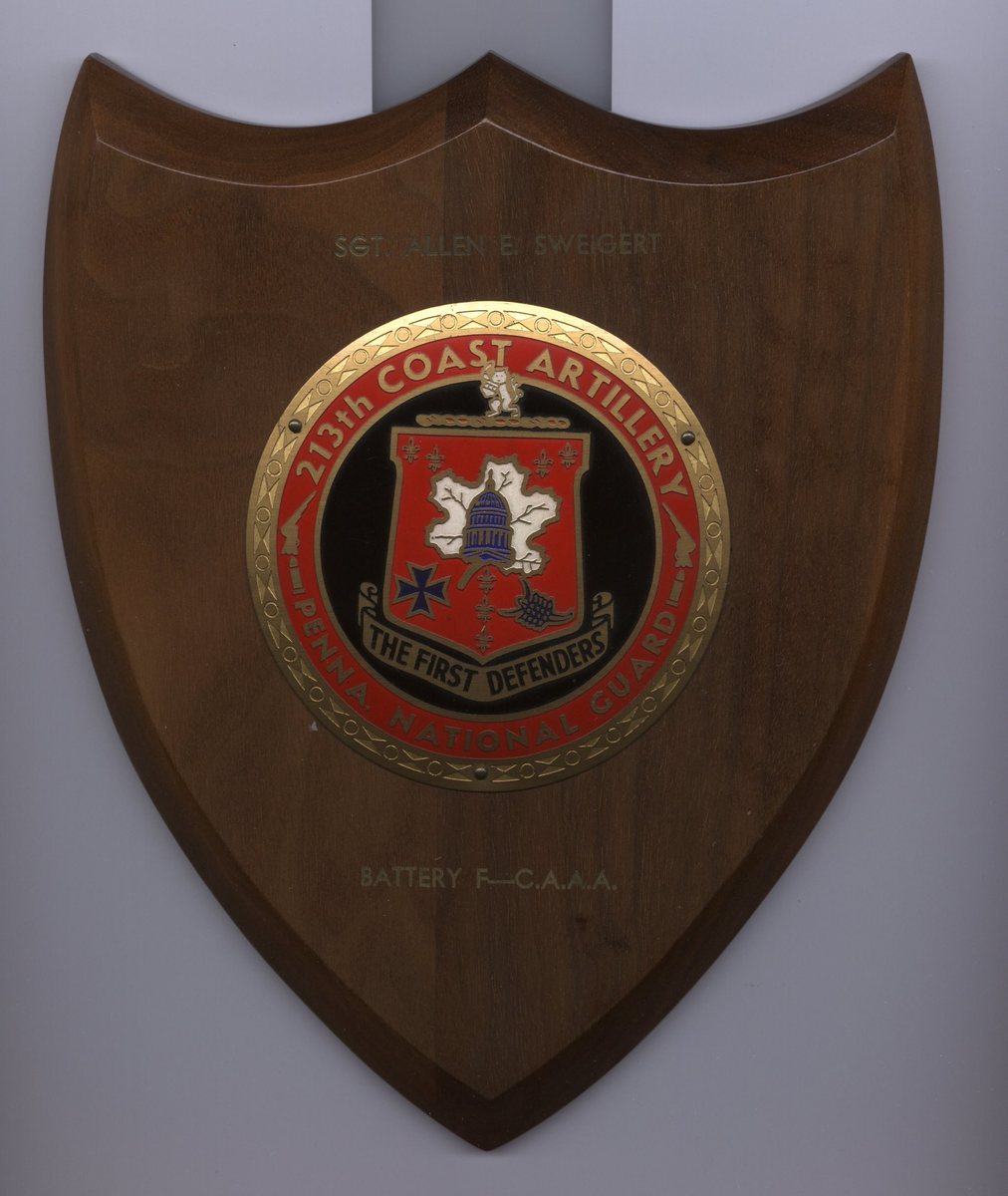 Allen's own unit shield: Battery F, 213th Coast Artillery (A.A.), Pennsylvania National Guard, “The First Defenders.”