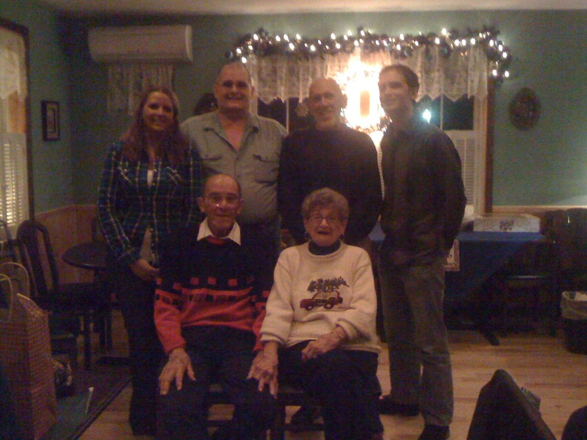The fine group itself, gathered for the holidays, December 2011 — Allen and Catherine with their sons, John and Allen Jr., and grandchildren Jeremy and Jessica. The last time the whole family got a photo together.