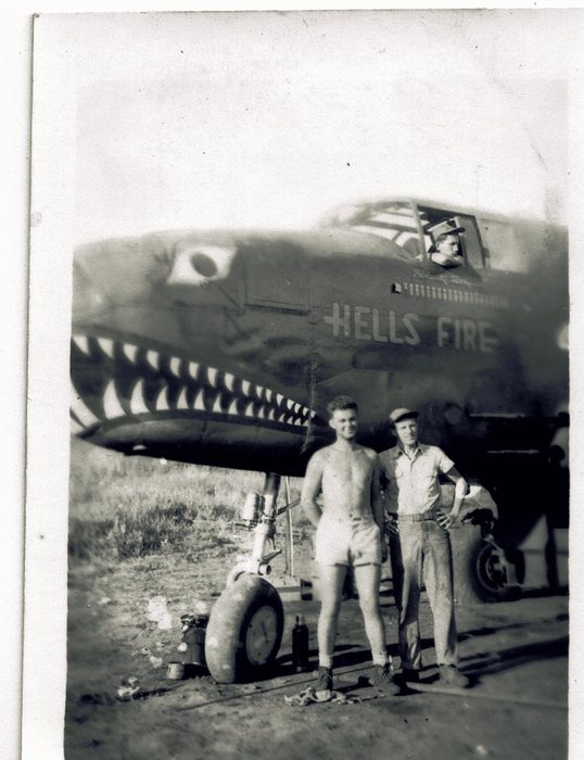 “Hell's Fire,” shark-mouth nose art and mission markings.