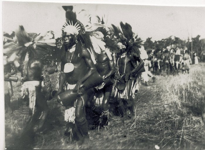 New Guinea villagers gathered, traditional dress and ornamentation.