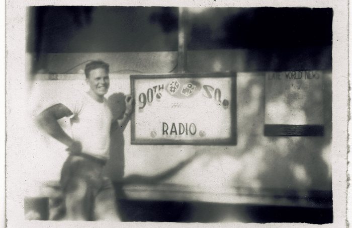 A “90th SQ Radio” sign beside the squadron's news bulletin board.