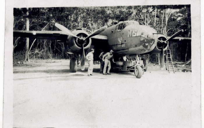 Ground crew load bombs beneath “Early Bird.”