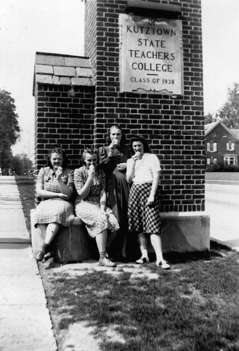 Catherine and friends beside a sign: “Kutztown State Teachers College, Class of 1938.”