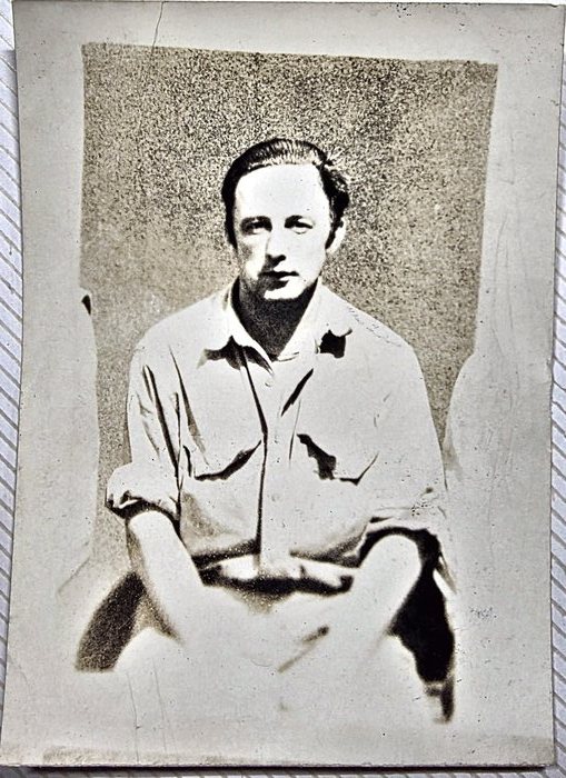 Leonard Cyr of Norway, Maine. A much-faded seated portrait of a young man in a light open-collar shirt with the sleeves turned back, hands in his lap, against a dark mottled backdrop; the back reads "Leonard Cyr." with "Norway, Maine" beneath it and carries a US Army censor stamp.