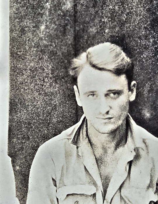 A fair-haired man in a light service shirt with a buttoned breast pocket turns his head to look off to one side of the camera. Named on the back as James W. Gillmer of Miami, Florida, though the surname could as easily read Gillner or Gilmer.