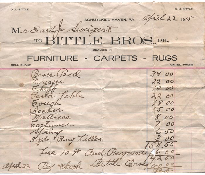 An itemised bill on the letterhead of "BITTLE BROS.", "DEALERS IN" "FURNITURE - CARPETS - RUGS" of "SCHUYLKILL HAVEN, PA.", dated "April 22" "1915" to "Mr Earl J. Sweigert". The hand-written list runs from a "Brass Bed" at 38.00 through dresser, "Chiff", parlor table, couch, rocker, mattress, "Costumer", spring and "5 yds Rug Filler", totalling "158.50" before a deduction marked "Less 10 %".